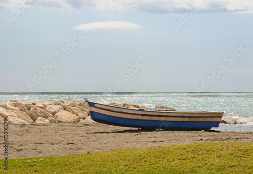 Small fishing boat on Spanish Beach © phildarby