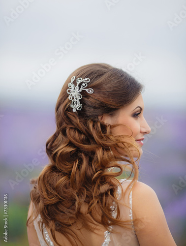 Beautiful bride in wedding dress in lavender field