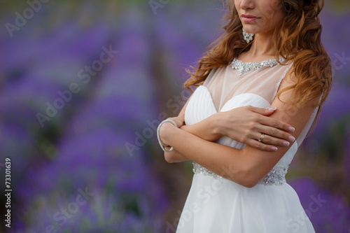 Beautiful bride in wedding dress in lavender field