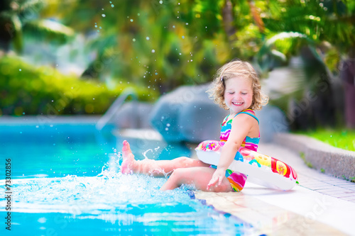 Little girl in a swimming pool © famveldman
