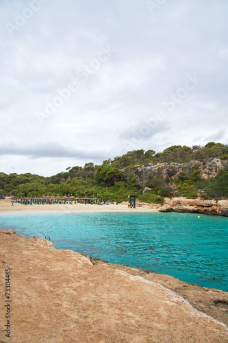 Sandy beach between the rocks. Private beach. © M-Production