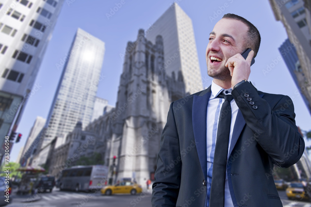 young businessman talking on the phone outdoors young businessman talking on the phone outdoors