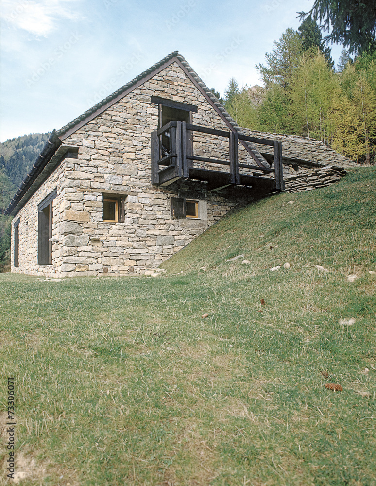 exterior view of a stone houe in mountain, Itlay exterior view of a stone houe in mountain, Itlay