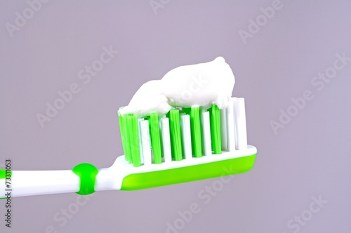 Toothpaste on toothbrush    Arena Photo UK