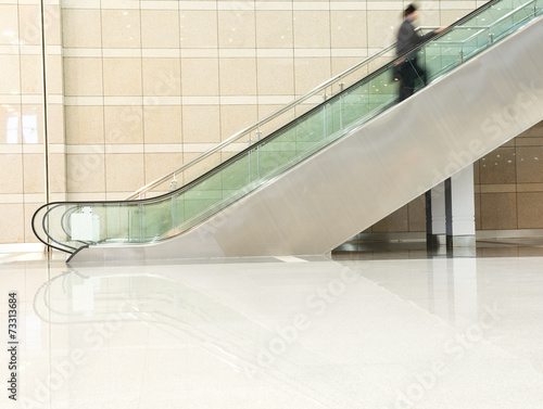 business people on escalator