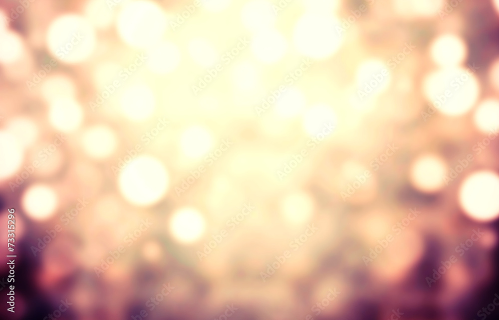 Obraz premium Abstract light celebration background with defocused golden ligh