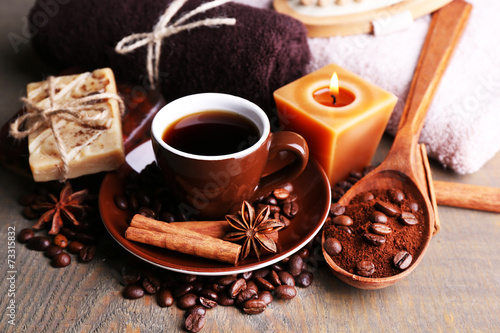 Cup with coffee drink, soap with coffee beans and spices,