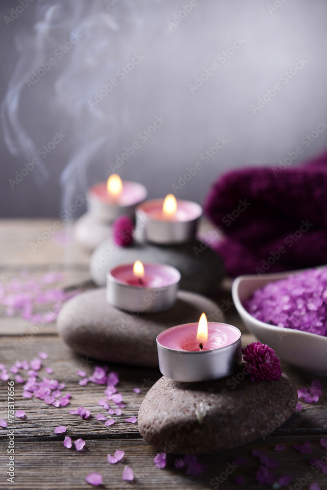Composition of spa treatment on table on grey background Composition of spa treatment on table on grey background
