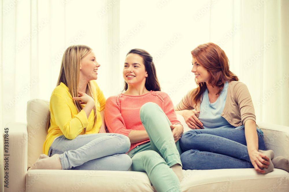 three girlfriends having a talk at home three girlfriends having a talk at home