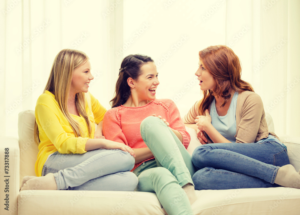 three girlfriends having a talk at home three girlfriends having a talk at home