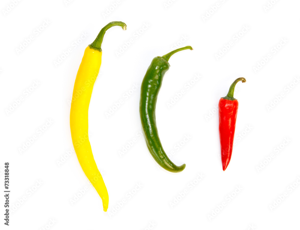 Three peppers in a row in different colors Three peppers in a row in different colors