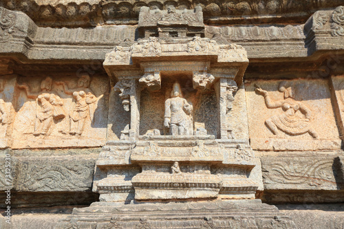 Ancient carved wall with hindu deities in Hazara Rama Jain