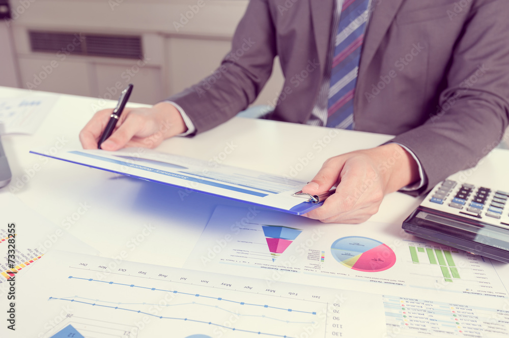 Businessman show analyzing report, business performance concept Businessman show analyzing report, business performance concept