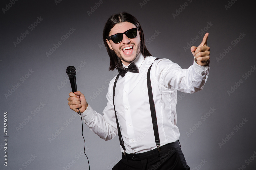 Funny singer with microphone at the concert Funny singer with microphone at the concert