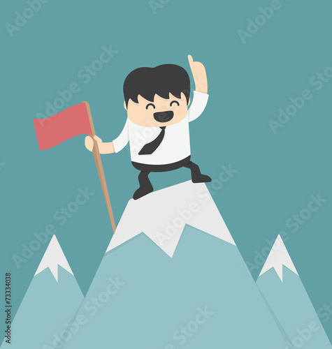 Businessman planting flag high Peak