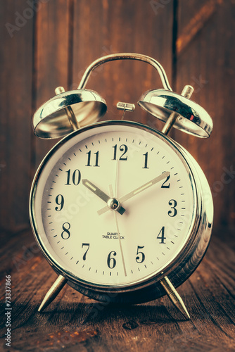 Clock on wood background