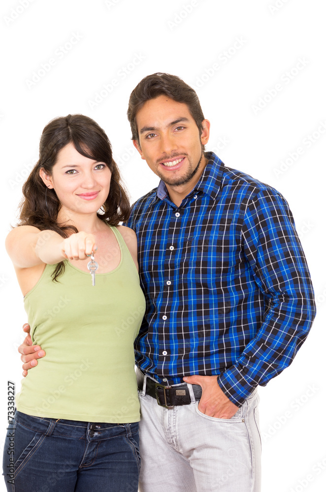 attractive young happy couple hugging and holding key