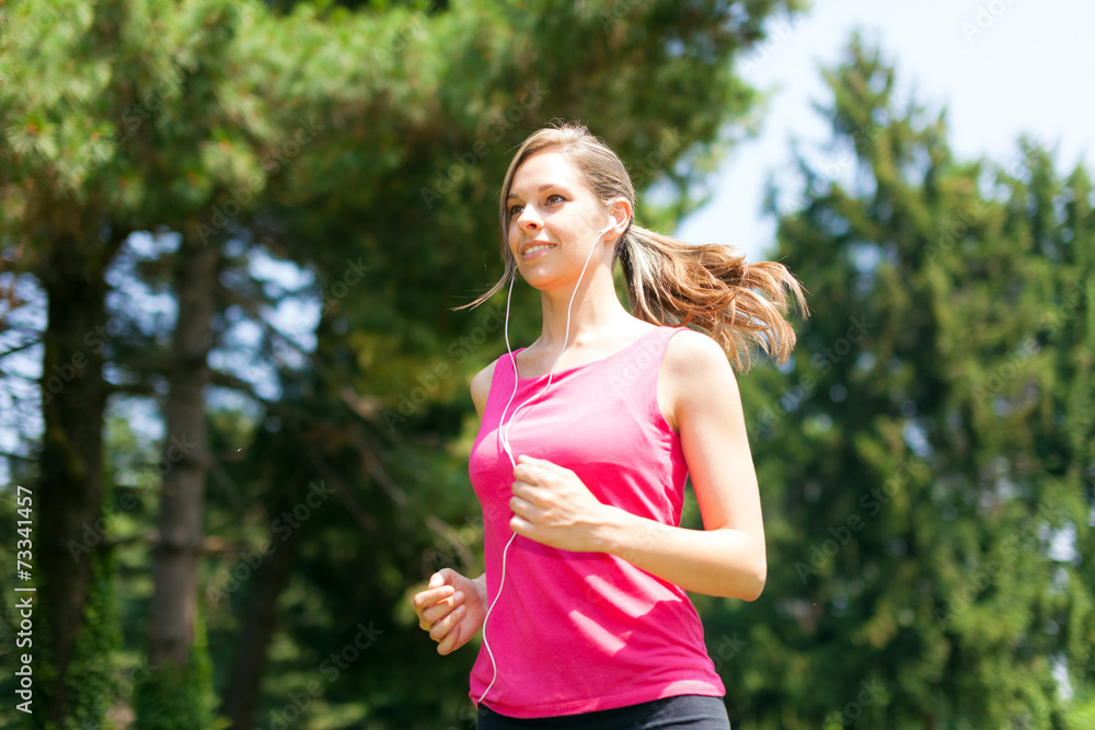 Woman doing jogging outdoors Woman doing jogging outdoors