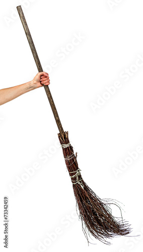 Hand holding wicked broom photo