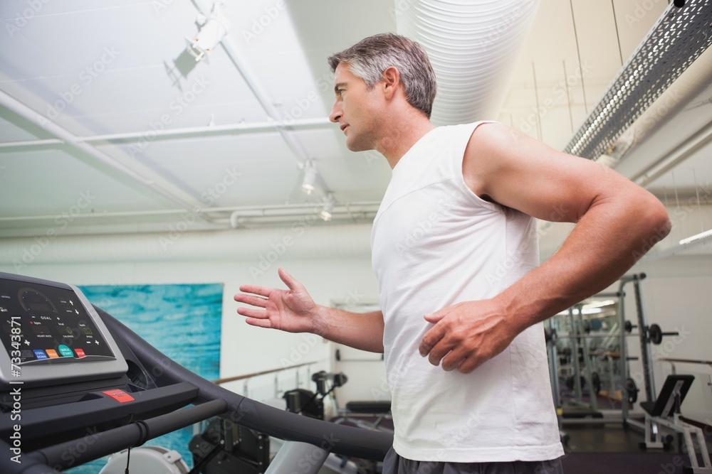 Fit man working out on treadmill Fit man working out on treadmill