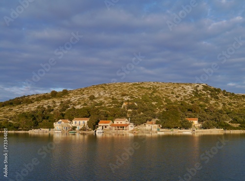 Houses on Lavsa in the Kornati national park in Croatia photo