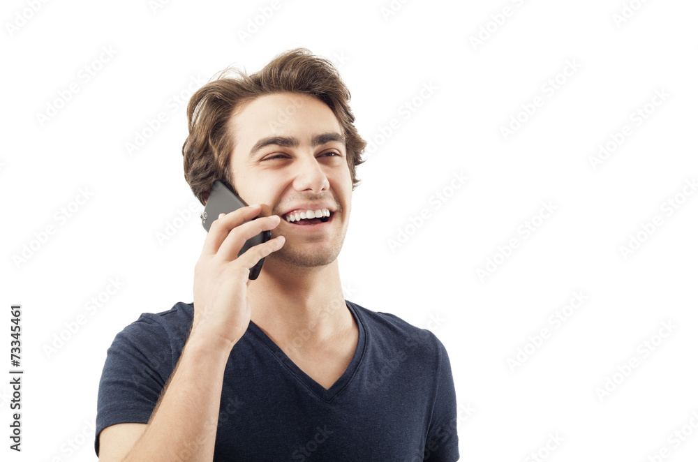 Happy young man talking on mobile phone Happy young man talking on mobile phone