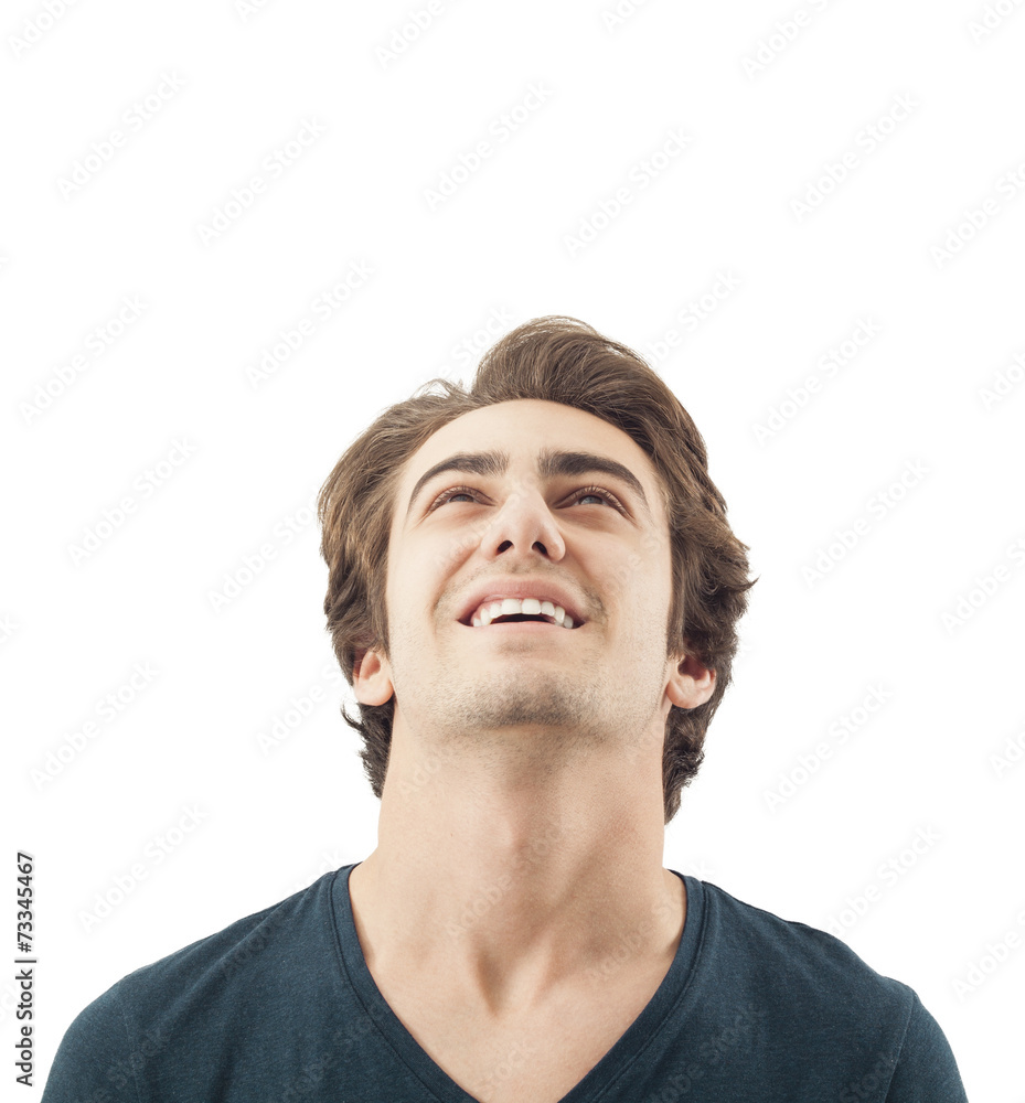 Obraz premium Handsome smiling man looking up on white