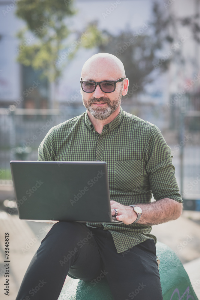 handsome middle aged man using notebook
