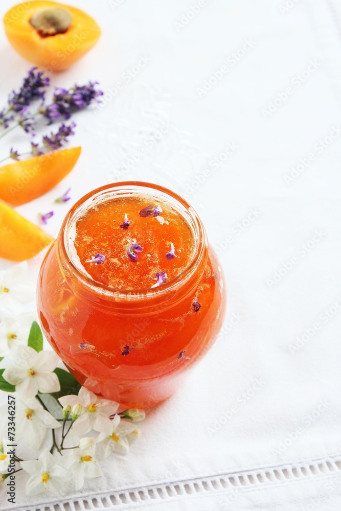 Homemade delicious apricot jam on a white background Homemade delicious apricot jam on a white background