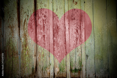 Heart carved on a wooden surface. The concept of Valentine's Day