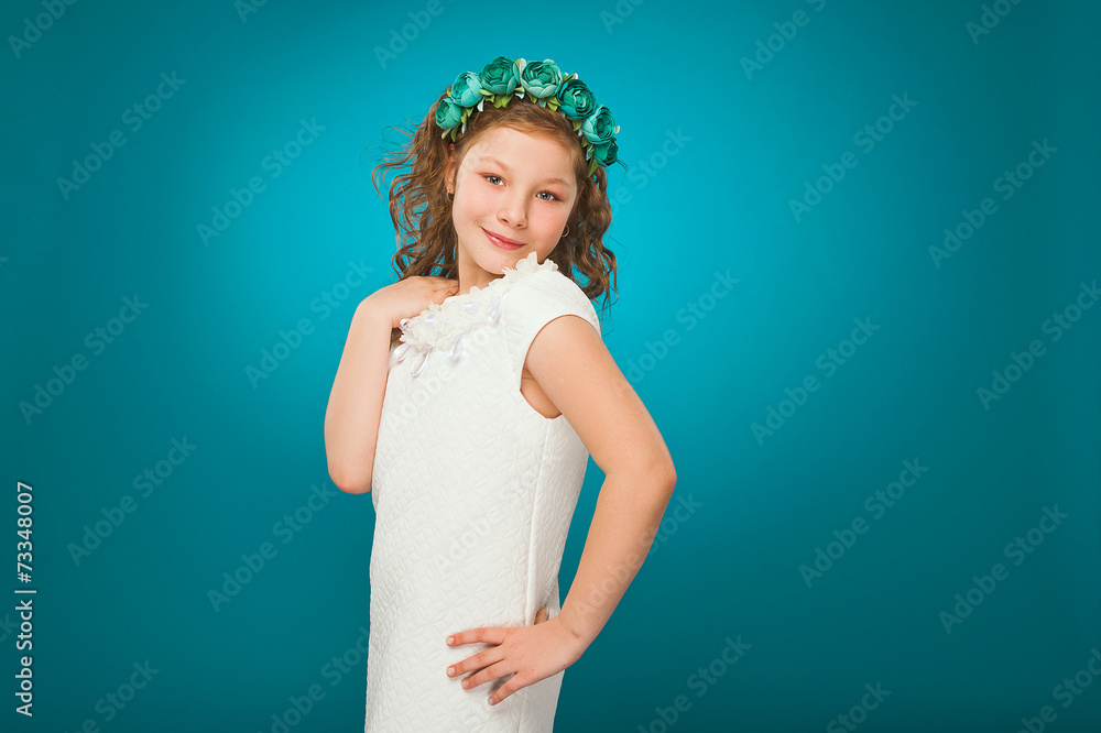 Girl smiling and looking at the camera in white dress Girl smiling and looking at the camera in white dress