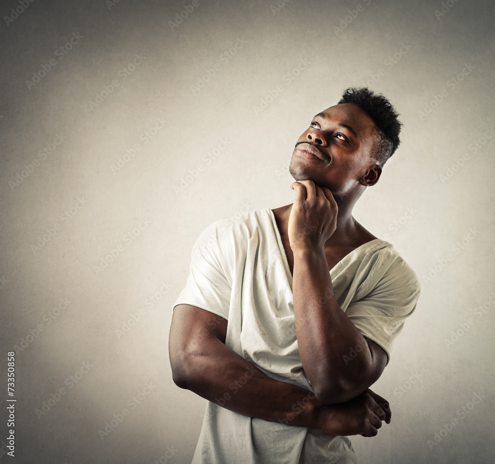 Delighted man thinking of something Delighted man thinking of something