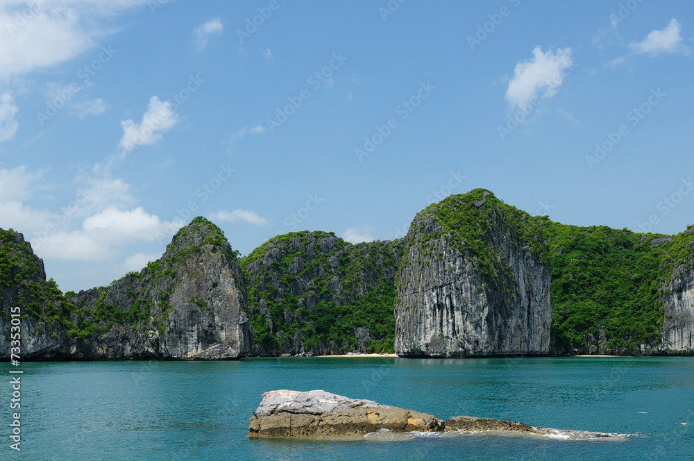 Small sandy beach in the Halong Bay in Vietnam