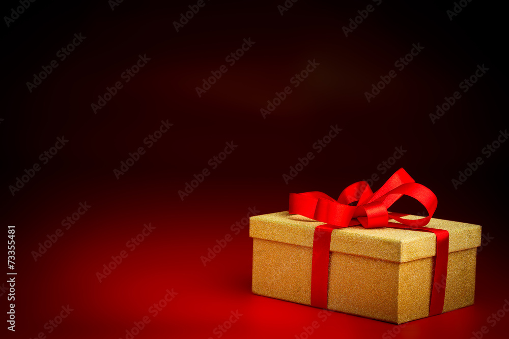 Golden Present Box With a Red Ribbon Golden Present Box With a Red Ribbon