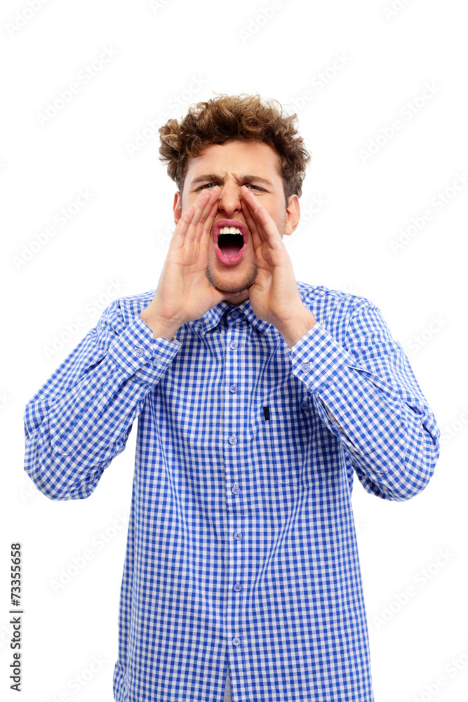 Portrait of a young man screaming over white background Portrait of a young man screaming over white background