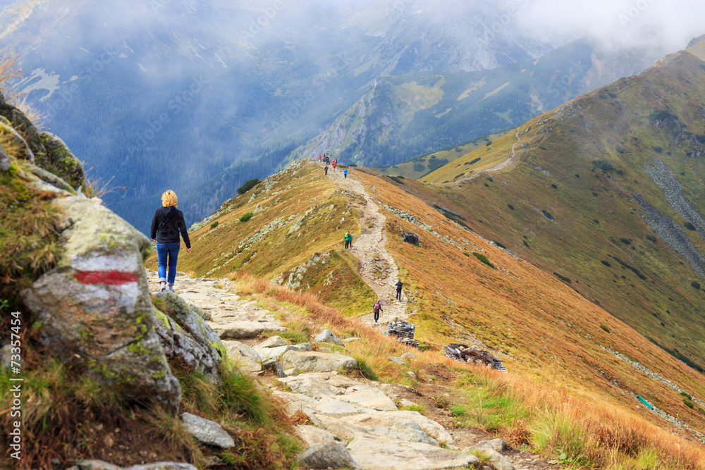 Group of tourists walking in the Tatra Mountains