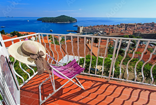 hat on chair in luxury balcony of Dubrovnik