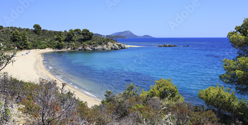 Pure white sand beach in the bay of Aegean Sea.