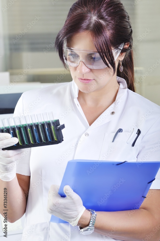 Attractive young PhD student scientist in laboratory Attractive young PhD student scientist in laboratory