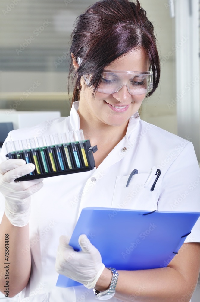 Attractive young PhD student scientist in laboratory Attractive young PhD student scientist in laboratory