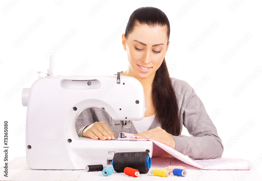 happy seamstress sewing. isolated on the white