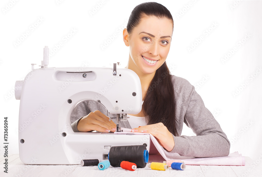 happy seamstress sewing. isolated on the white