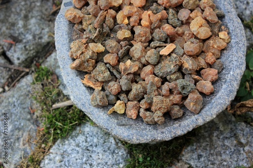 Obraz na plátně Myrrh incense tears (myrrhae gummi from kenia) in tears in a stone bowl with a n