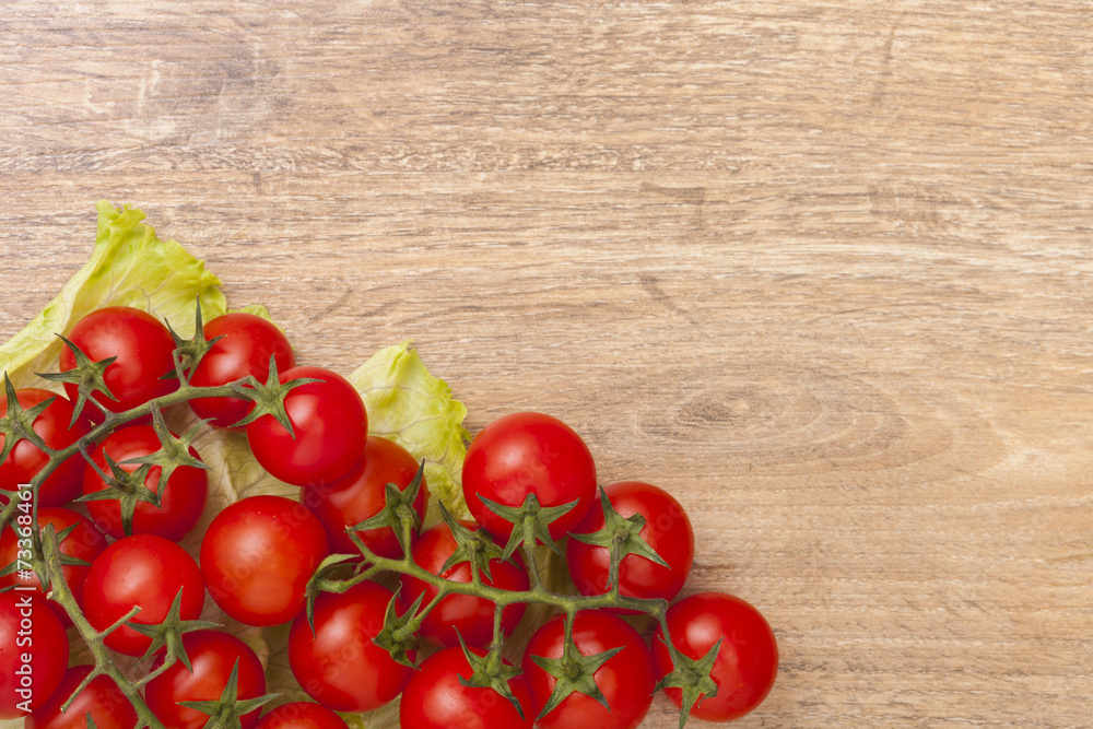 Red tomatoes on wooden board Red tomatoes on wooden board