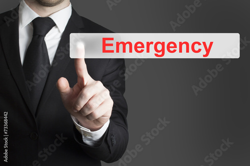 businessman pushing flat button emergency