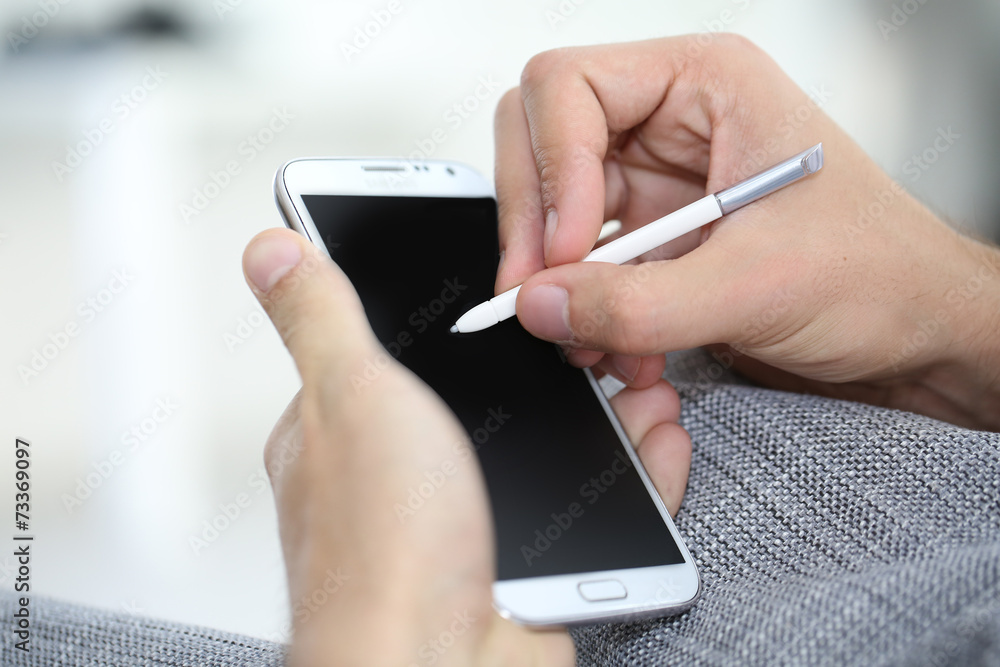 Closeup of digital pen on smartphone screen Closeup of digital pen on smartphone screen
