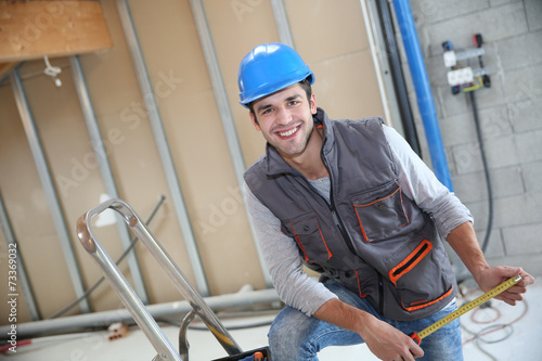 Young construction worker on site