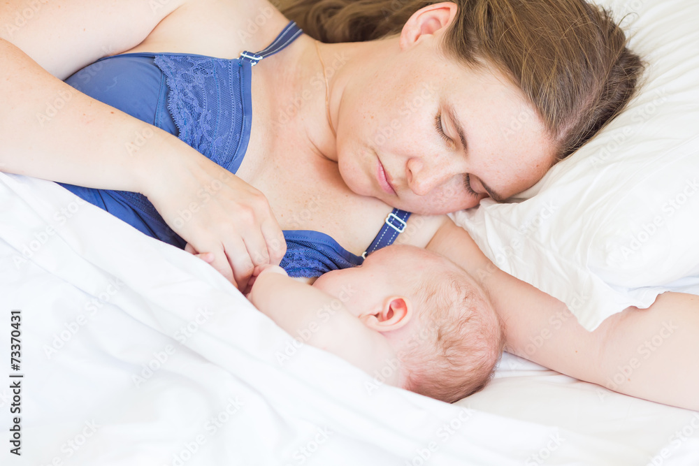 Happy mother breast feeding her baby infant Happy mother breast feeding her baby infant