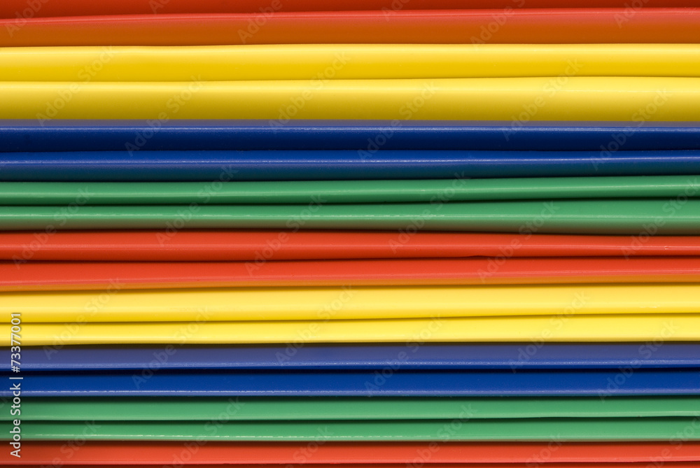 Close-up of Brightly Colored Plastic File Folder Spines Close-up of Brightly Colored Plastic File Folder Spines