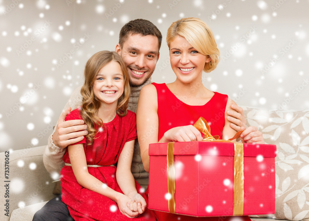 smiling family holding gift box smiling family holding gift box